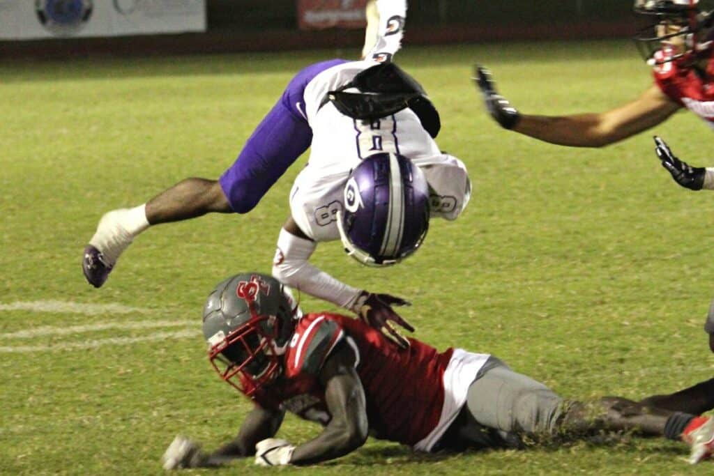 Santa Fe's Dontrel Jenkins upends Gainesville's Donteau Jenkins on Friday night.