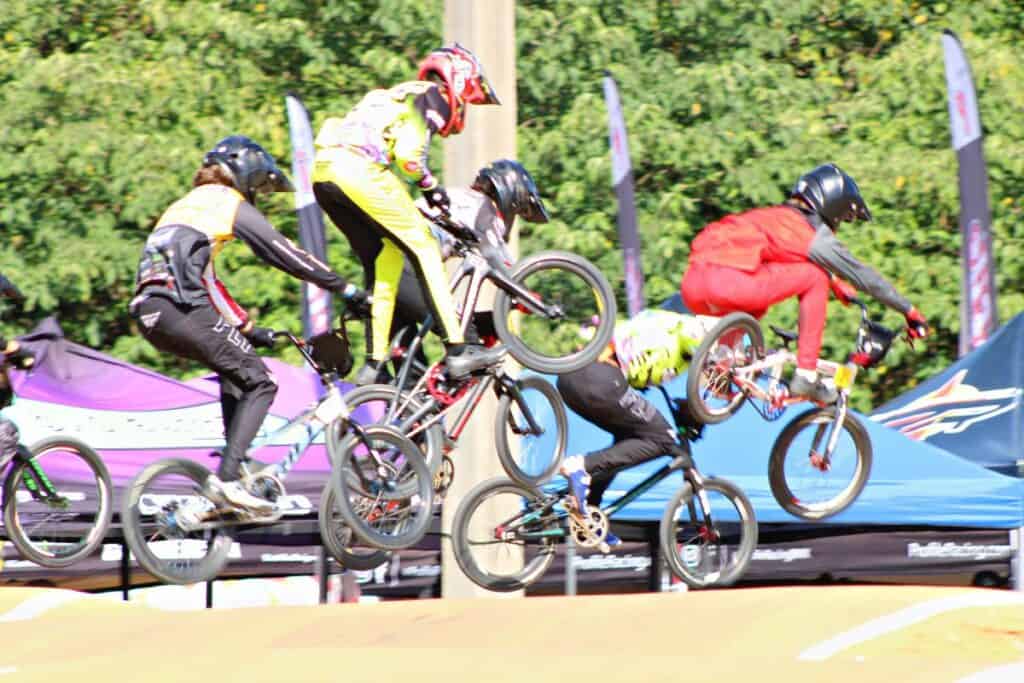 USABMX Southeast Region Gold Cup Championships in High Springs racers jumping.