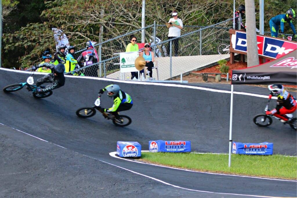 USABMX Southeast Region Gold Cup Championships in High Springs racers on curve.