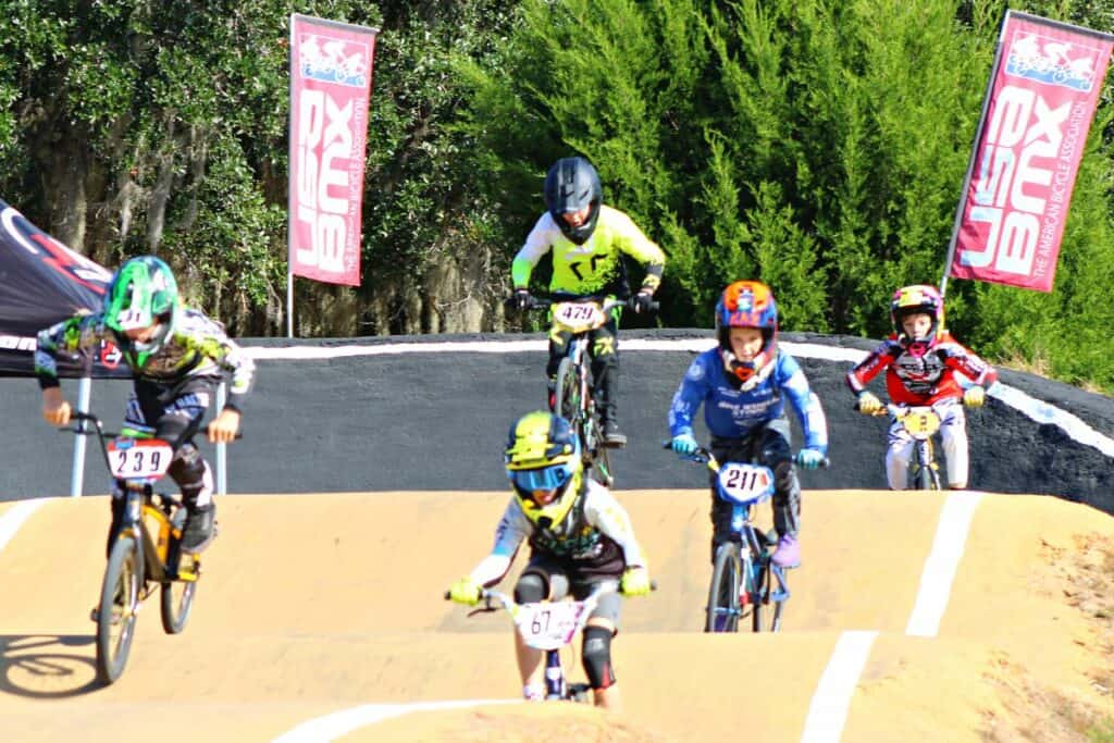 USABMX Southeast Region Gold Cup Championships in High Springs racers on hills.