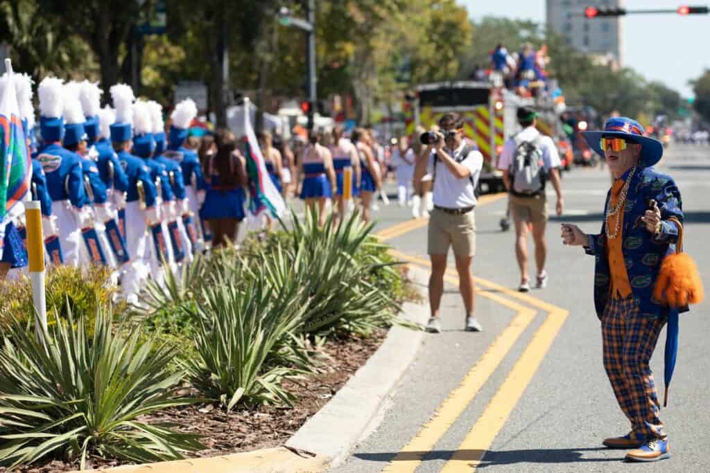 2022 UF Homecoming Parade with marching band and firetruck.