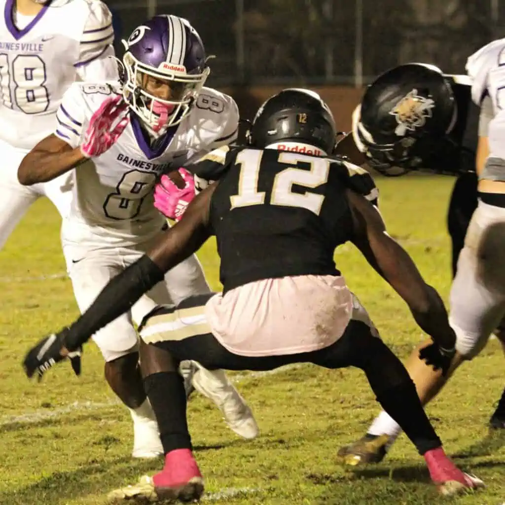 Buchholz's Camron Boykin brings down GHS's Donteau Jenkins on Thursday.
