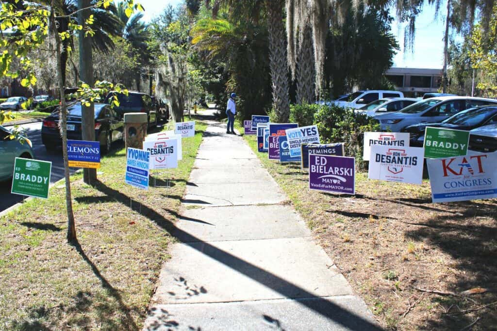 Campaign signs outside the Alachua County Supervisor of Elections Office.