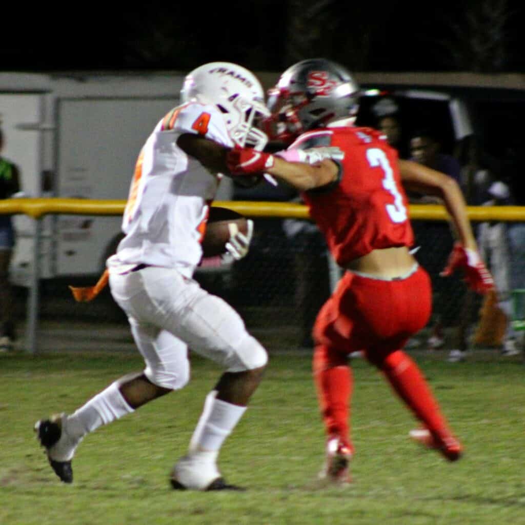Eastside's Antonio Hubbert gets past Santa Fe's KJ Johnson on his way to a touchdown on Friday.