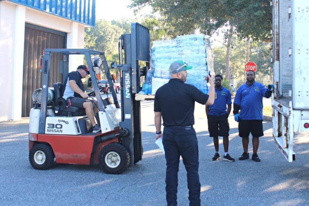 Hurricane Ian relief supplies being loaded onto a truck at SF College's Northwest Campus on Monday morning.
