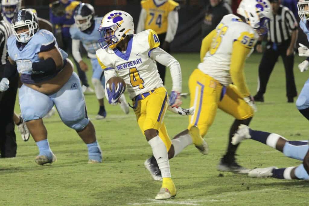 Newberry's Michael Moore with the first of his four interceptions at P.K. Yonge on Friday.