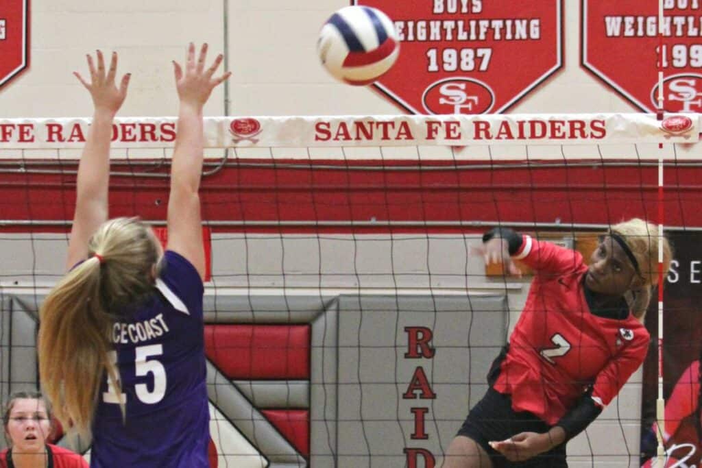 Santa Fe's Camille Johnson with one of her nine kills against Space Coast on Tuesday.