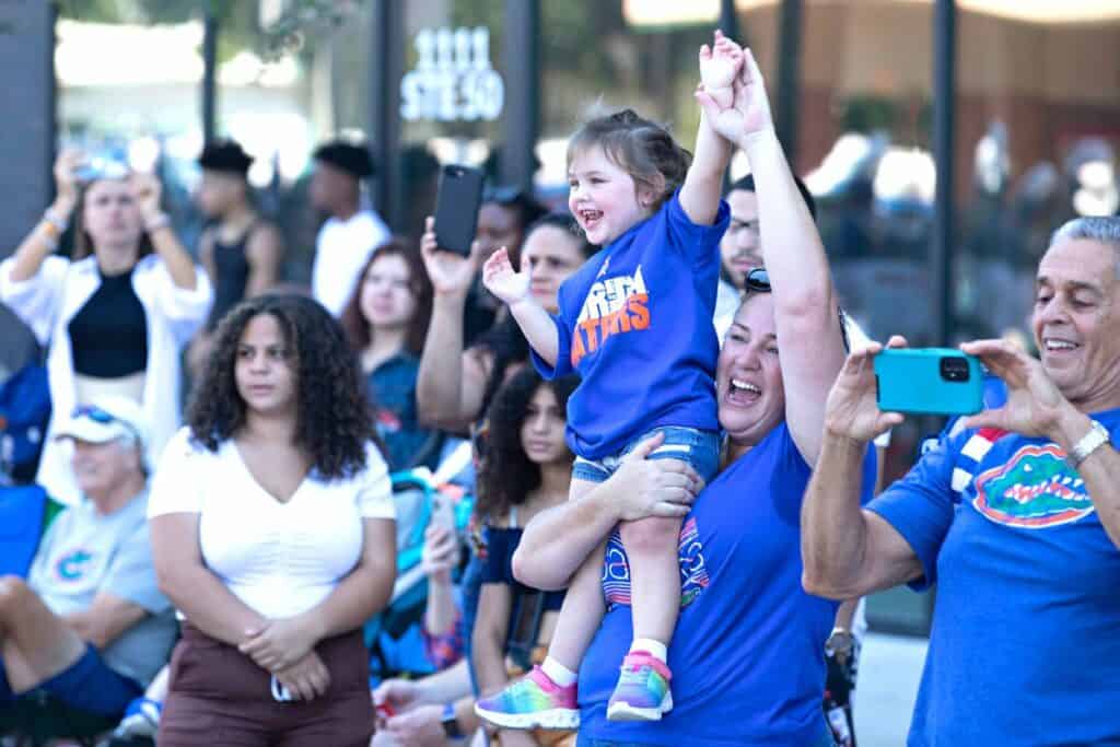 Spectators at the UF Homecoming Parade on Friday.