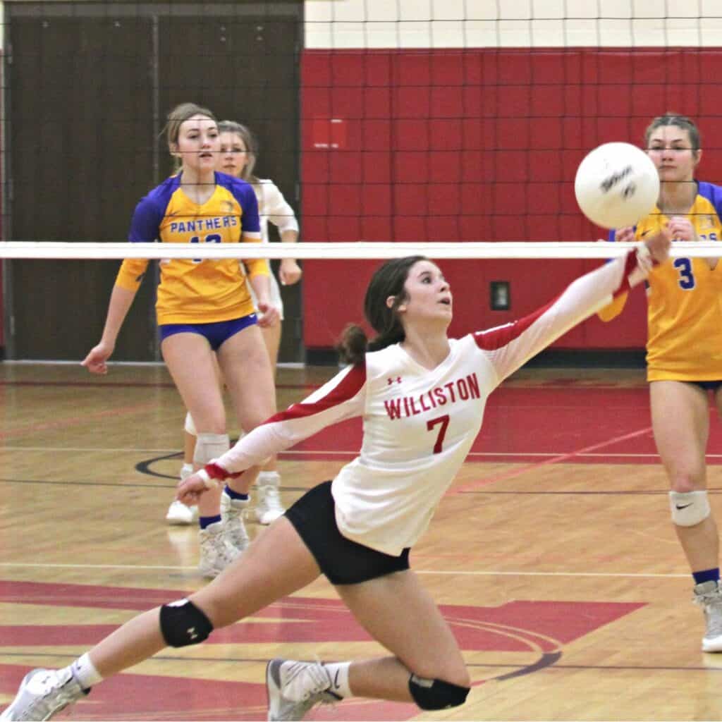Williston's Jenna Yancey with a dig against Newberry on Friday.