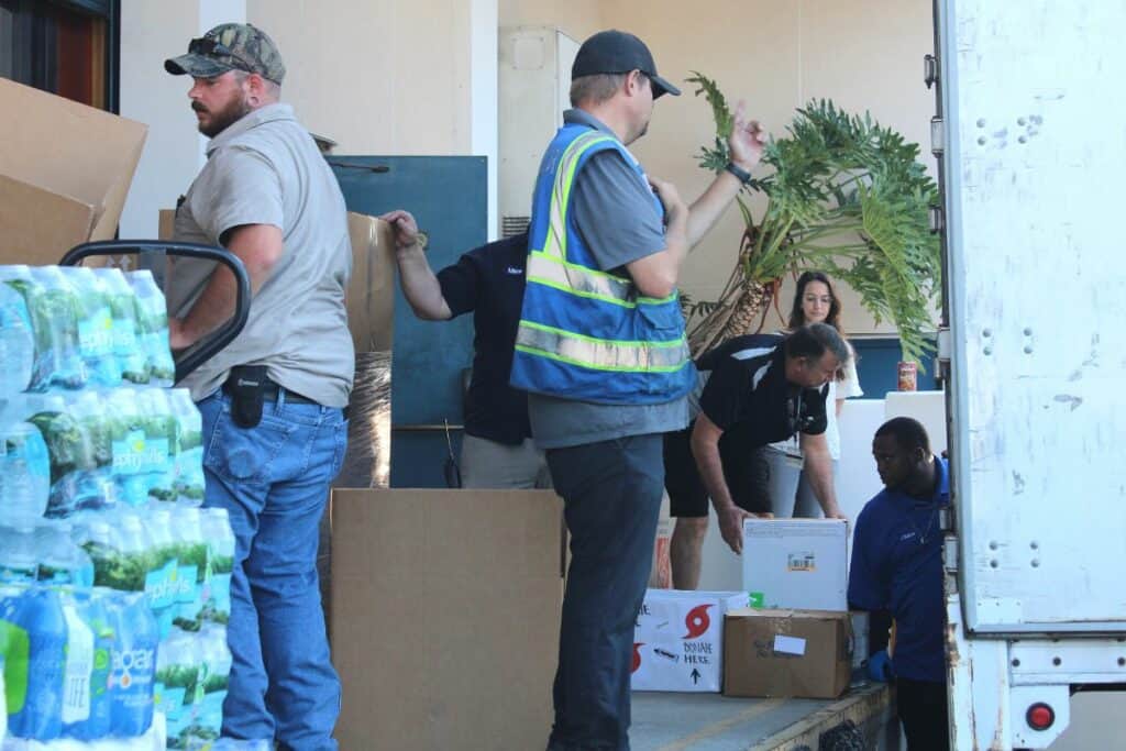 Workers at SF College loading Hurricane Ian donations onto a truck.