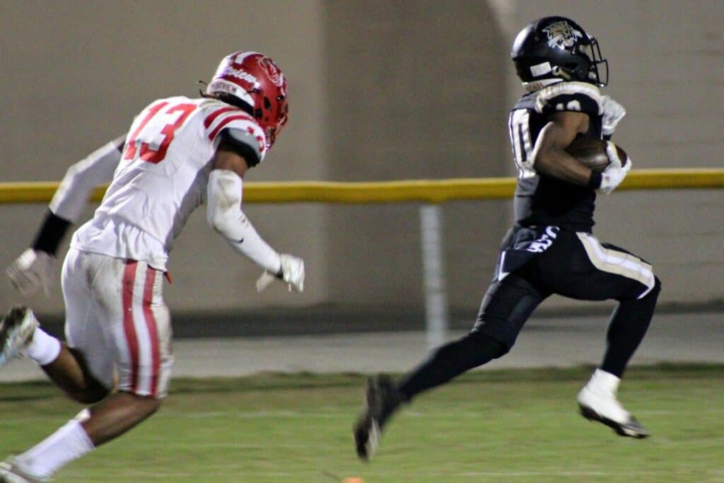 Buchholz's Quinton Culer races for a first half touchdown against Crestview on Friday.