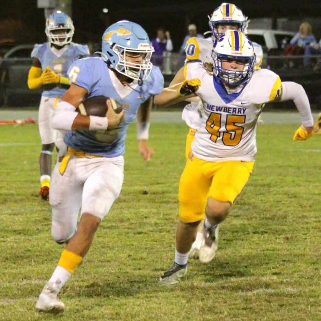 Chiefland's Osten Jones takes a punt return back 48 yards for a touchdown against Newberry on Friday.