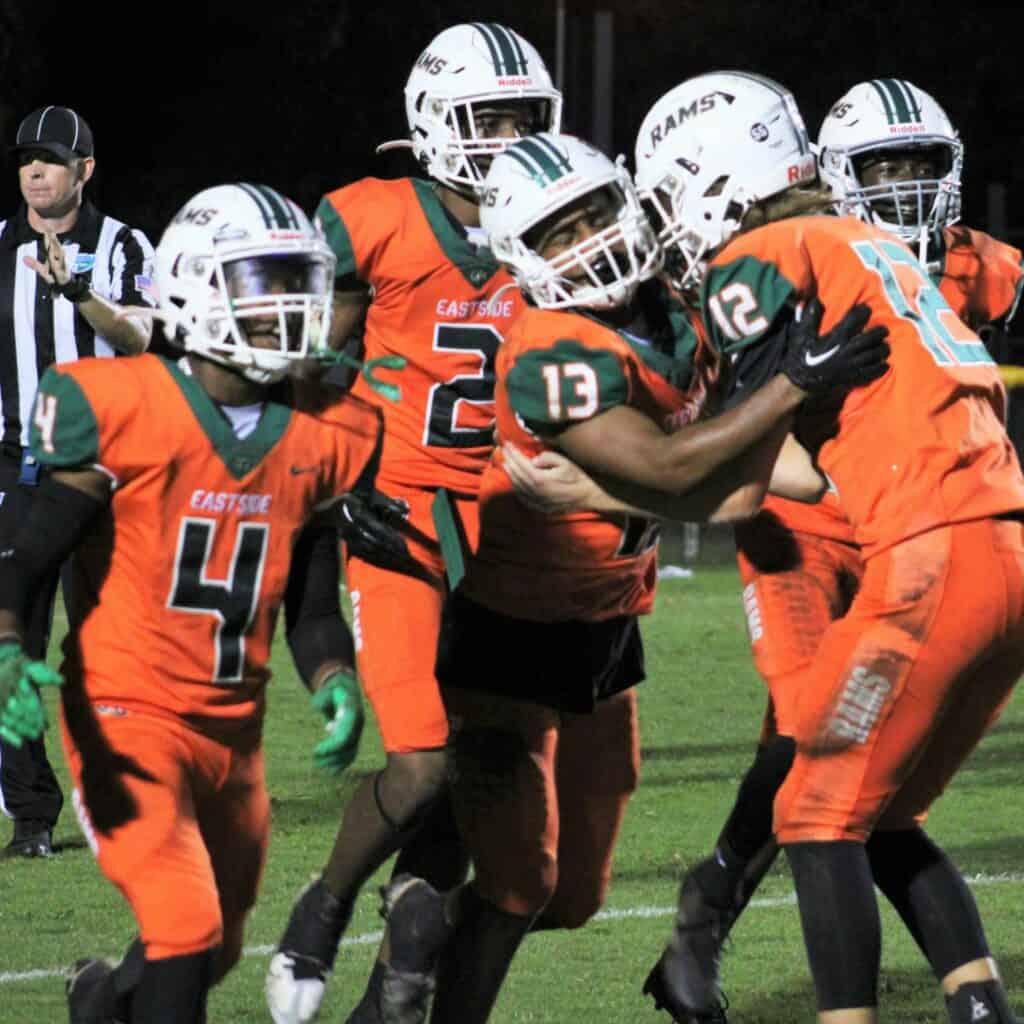 Eastside players celebrate Daijon Johnson's (13) diving touchdown catch in the second quarter on Friday.