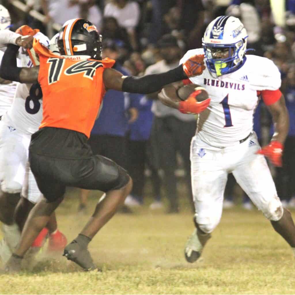 Hawthorne's Jailen Ruth goes for a tackle against Pahokee on Friday.