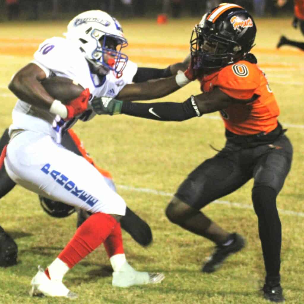 Hawthorne's Tyelor Waters goes for a tackle against Pahokee on Friday.