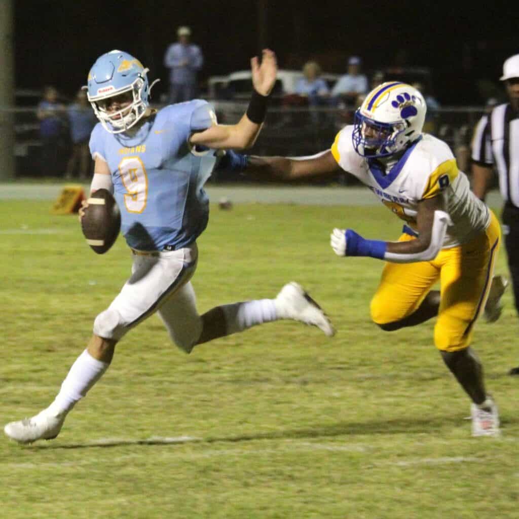 Newberry's Mykah Newton zeros in on Chiefland's Michael Tovine for a first quarter sack on Friday.