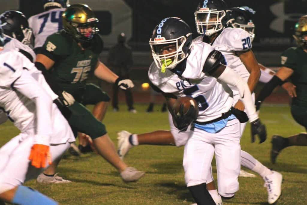 P.K. Yonge's Kyran Taylor returns a kick against Trinity Catholic on Friday.