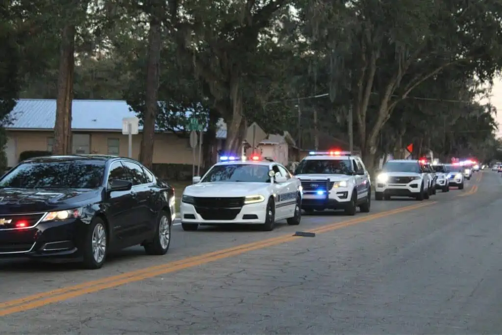 A police procession started the Night of Compassion event at the Clarence R. Kelly Center on Friday.