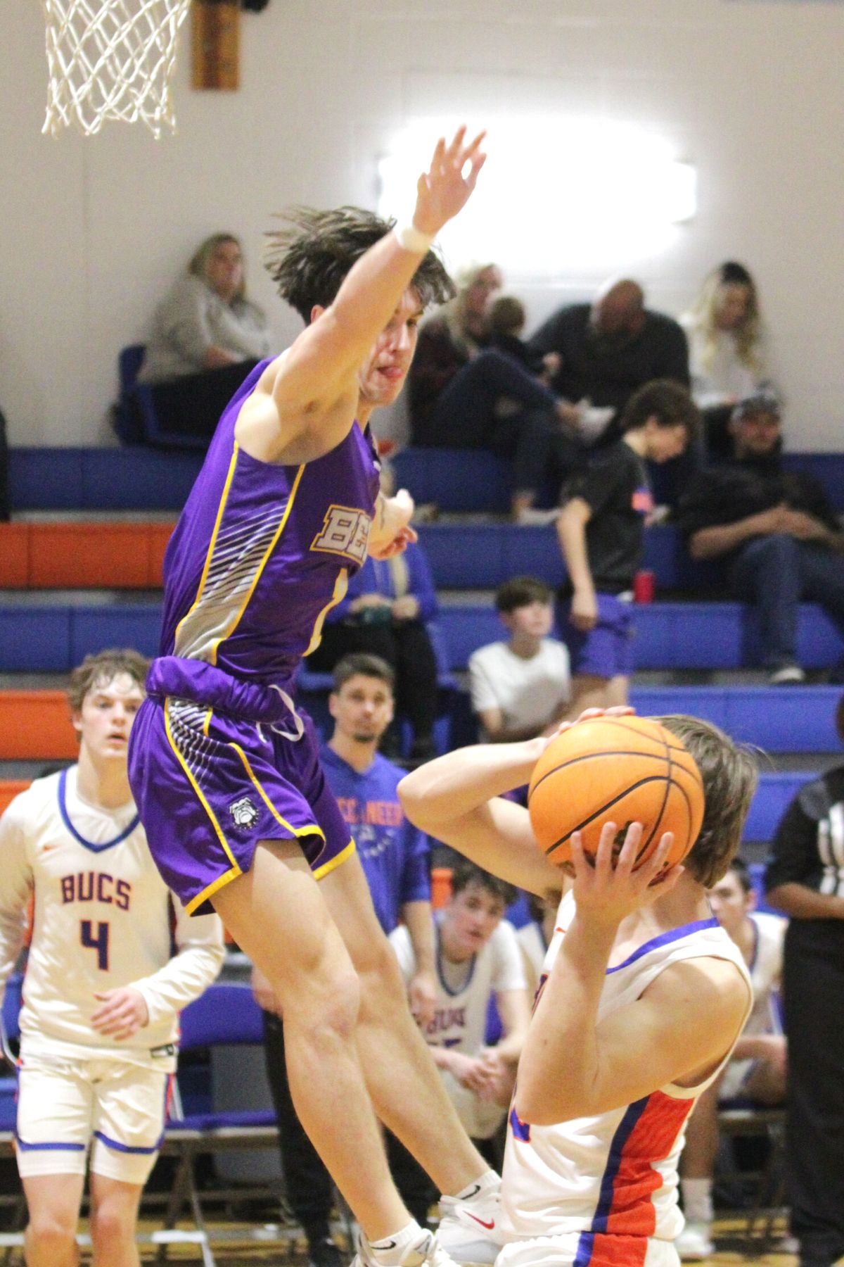 Bell's Connor Hastings attempts to block Branford's Tyrick Hunt shot on Wednesday.
