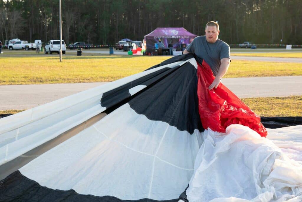 Brian R. Chase of Cartoon Balloons of Orlando unfolds a Sylvester the cat balloon.