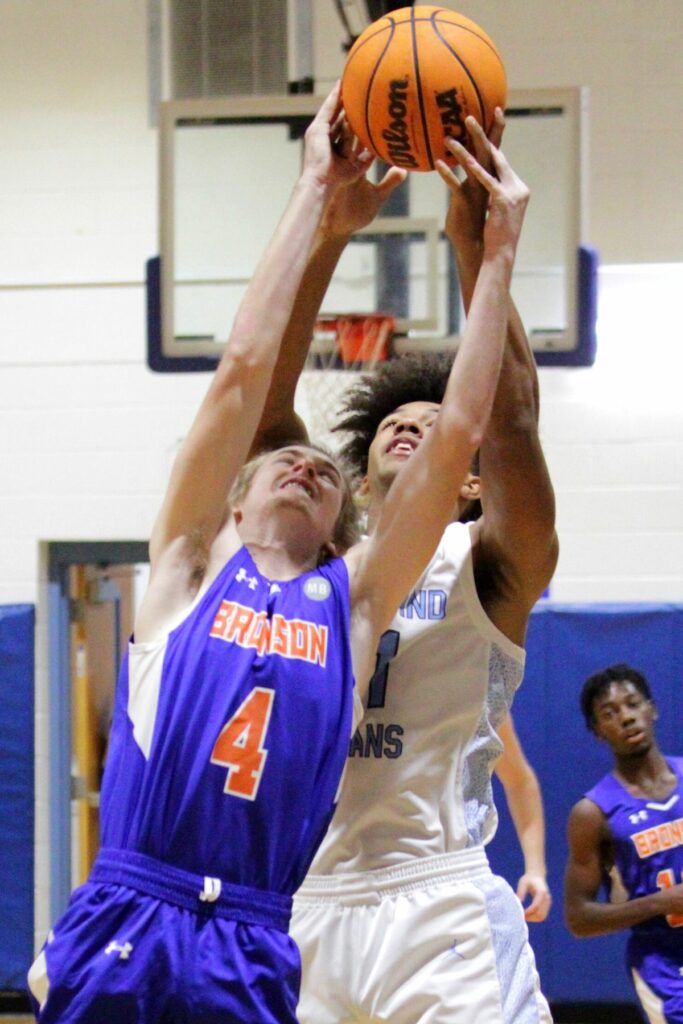 Bronson's Justin Cohoon and Chiefland's Johnathan Adams battle for a loose ball on Wednesday.