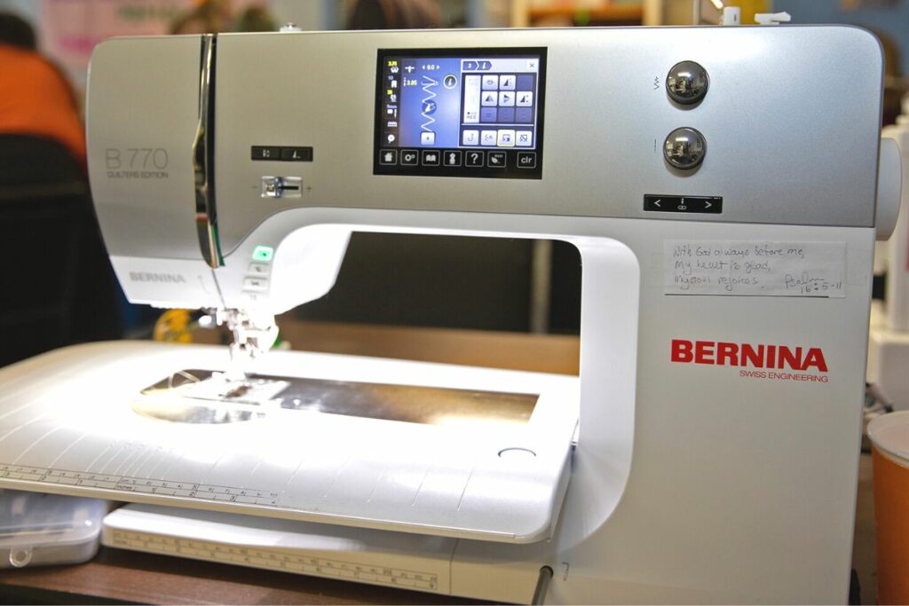 Carol Nabakowski brought her own sewing machine to the quilt-a-thon. On it, she has taped a portion of the Bible Psalm 16 With God always before me, my heart is glad, my soul rejoices.