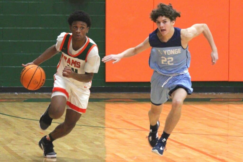 Eastside's Moses Horne dribbles by P.K. Yonge's Jantzen Griffin on Tuesday.