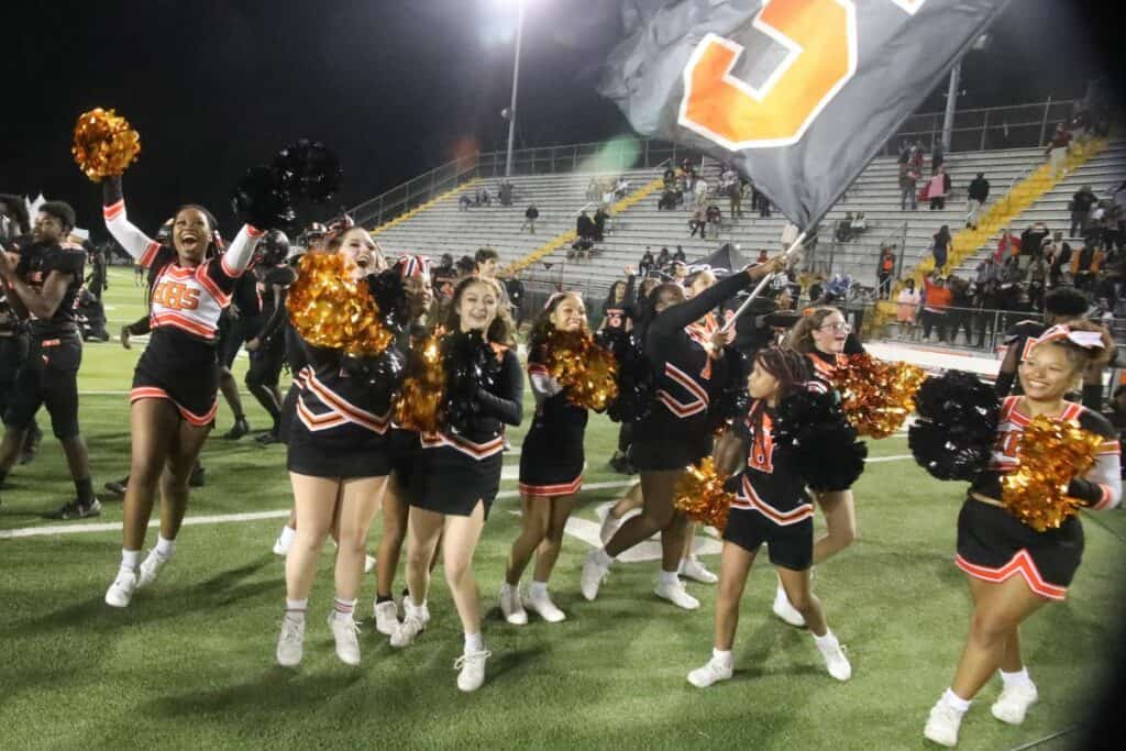 Hawthorne cheerleaders celebrate the Hornets' 13-2 state championship win over Northview on Saturday.
