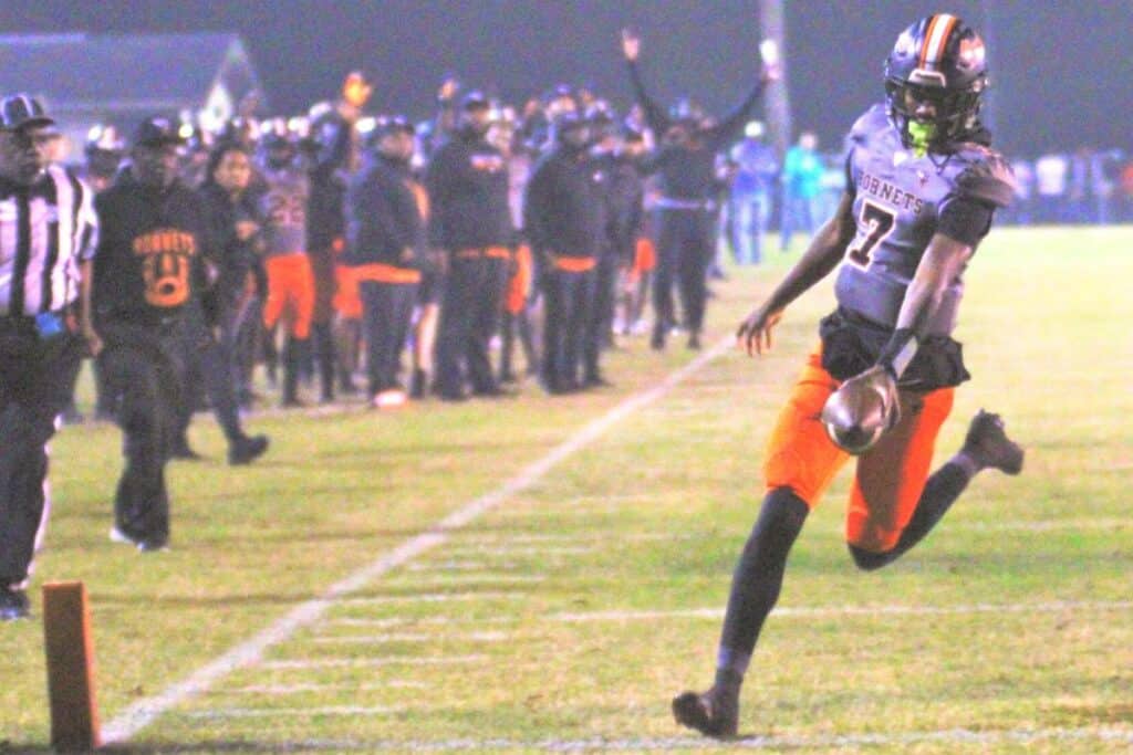 Hawthorne's CJ Ingram walks into the end zone untouched to give the Hornets the first touchdown of the game against Blountstown on Friday.