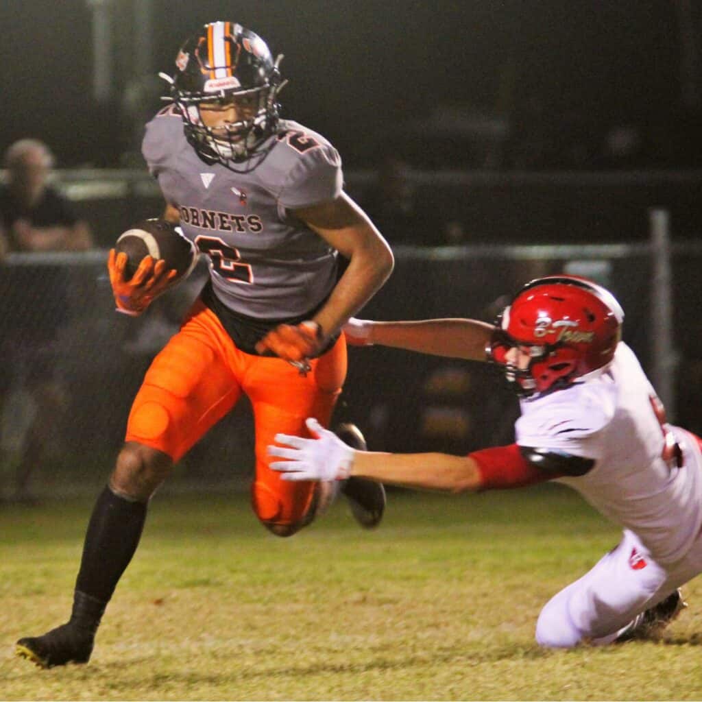 Hawthorne's Darian Smith-Williams breaks a tackle at the 4-yard line before returning a punt 96 yards for a touchdown.