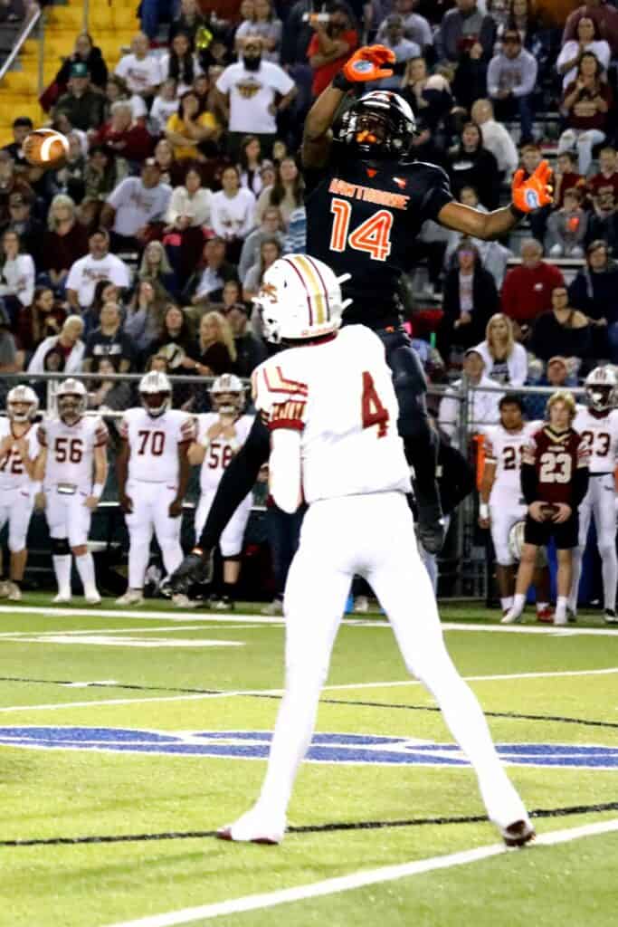 Hawthorne's Jailen Ruth pressures Northview's Kadem Odom into a third-quarter interception on Saturday.