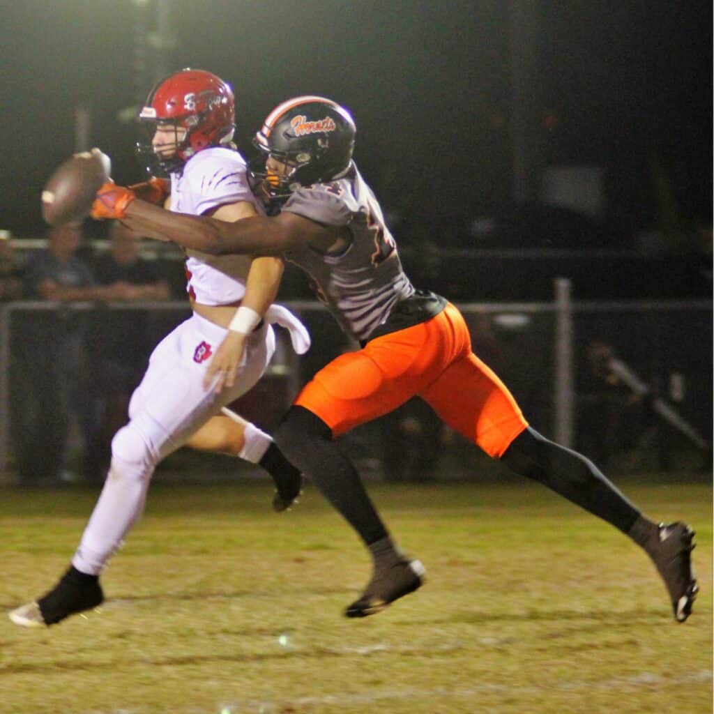 Hawthorne's Jailen Ruth tackles the Tigers' quarterback for a safety for a 14-point lead on Friday.