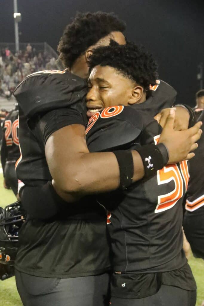Hawthorne's Mozell Williams (left) and Darian Owens celebrate win over Northview on Saturday.