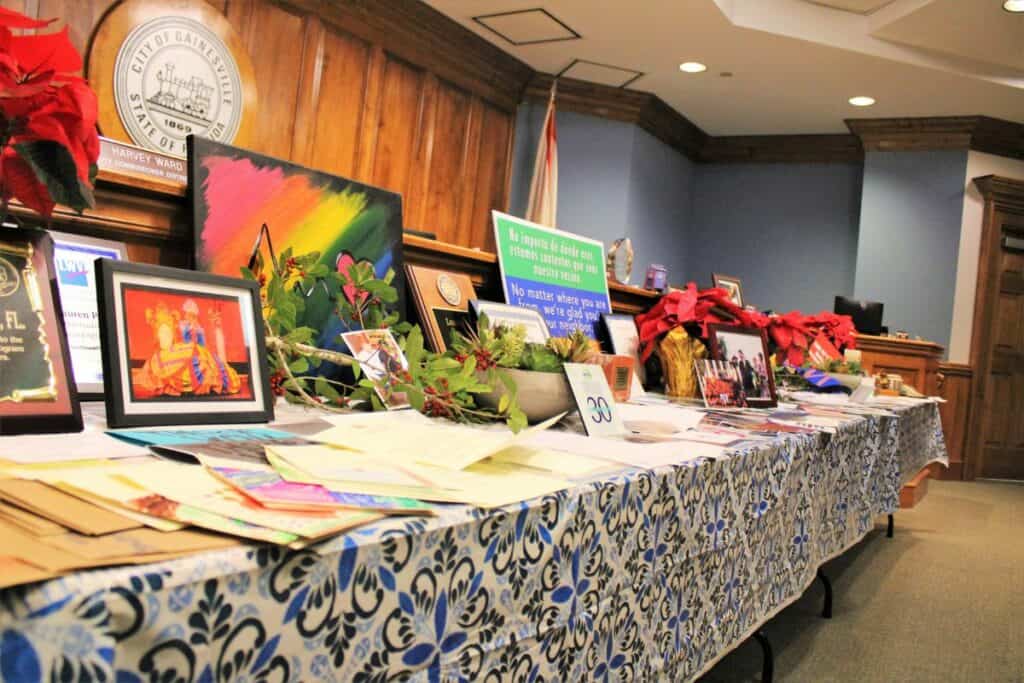 Memorabilia from Mayor Lauren Poe, Commissioner Adrian Hayes-Santos and Commissioner David Arreola lined the dais for a farewell ceremony.