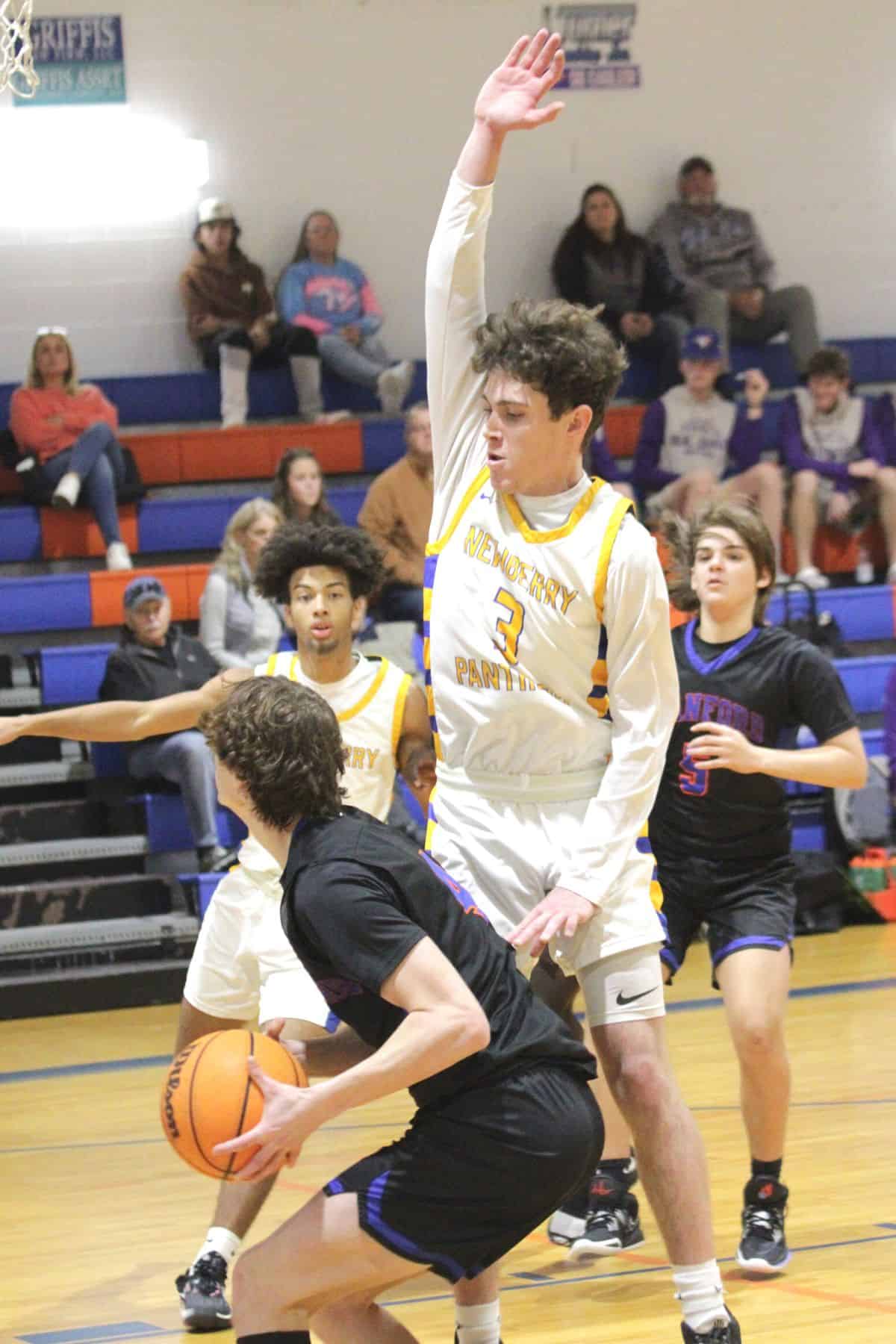 Newberry's Mason Smit defends Branford's Camden Gaskins on Tuesday.