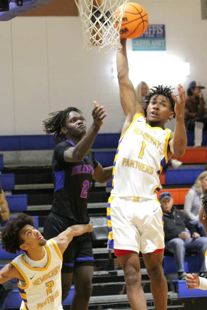 Newberry's Mike Moore with a rebound against Branford on Tuesday.