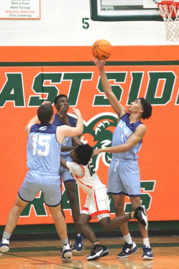 P.K. Yonge's Caleb Warren blocks Eastside's D.J. Slater's shot on Tuesday.