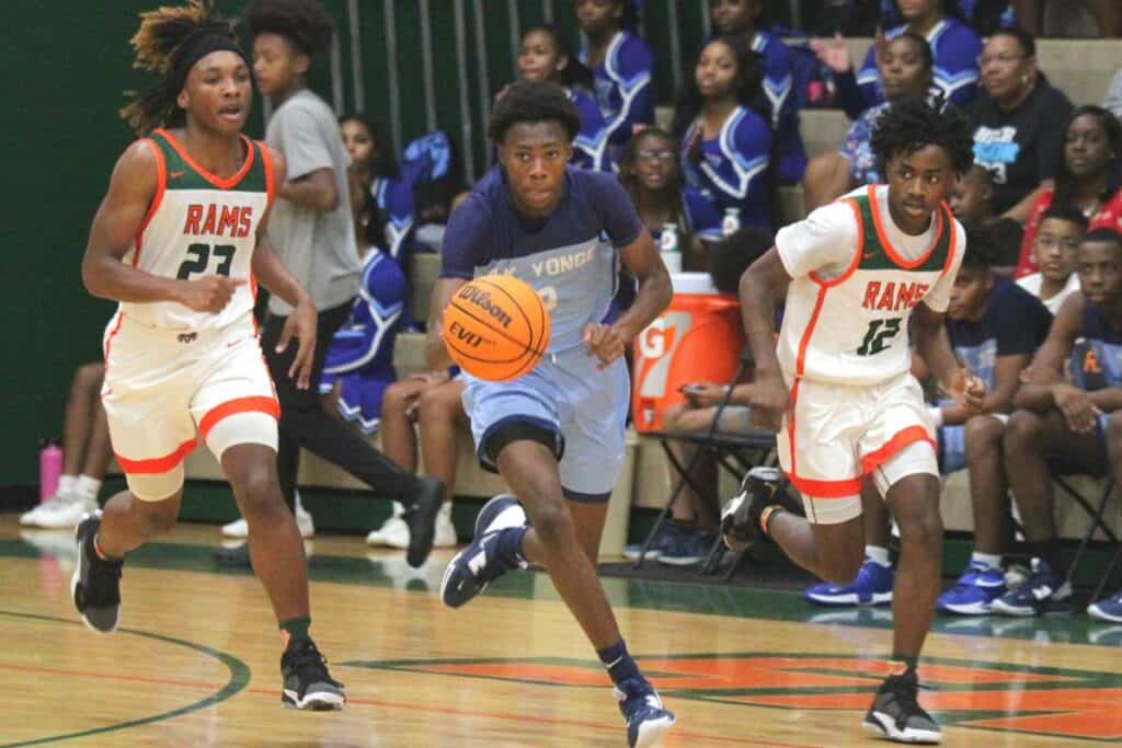 P.K. Yonge's Elijah Harris dribbles past Eastside's Quashawn Brittingham (23) and D.J. Slater (12) on Tuesday.