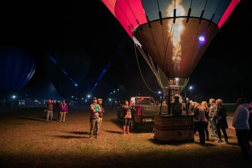 Pilot Henry Rosenbaum's balloon, center, holds 60,000 cubic feet of air, the equivalent of 401,083 NFL footballs. Rosenbaum is from Mechanicsville, Virginia.