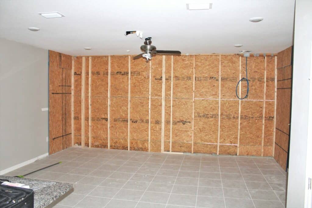 Plywood boards up on Matt Mosch's back wall.