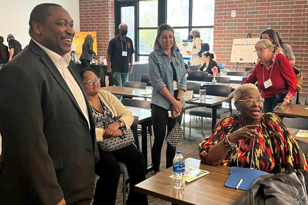 SF President Paul Broadie (left) with keynote speaker Vivian Filer (seated right) at the Opportunities and Benefits of Heritage Foods Symposium on Friday.