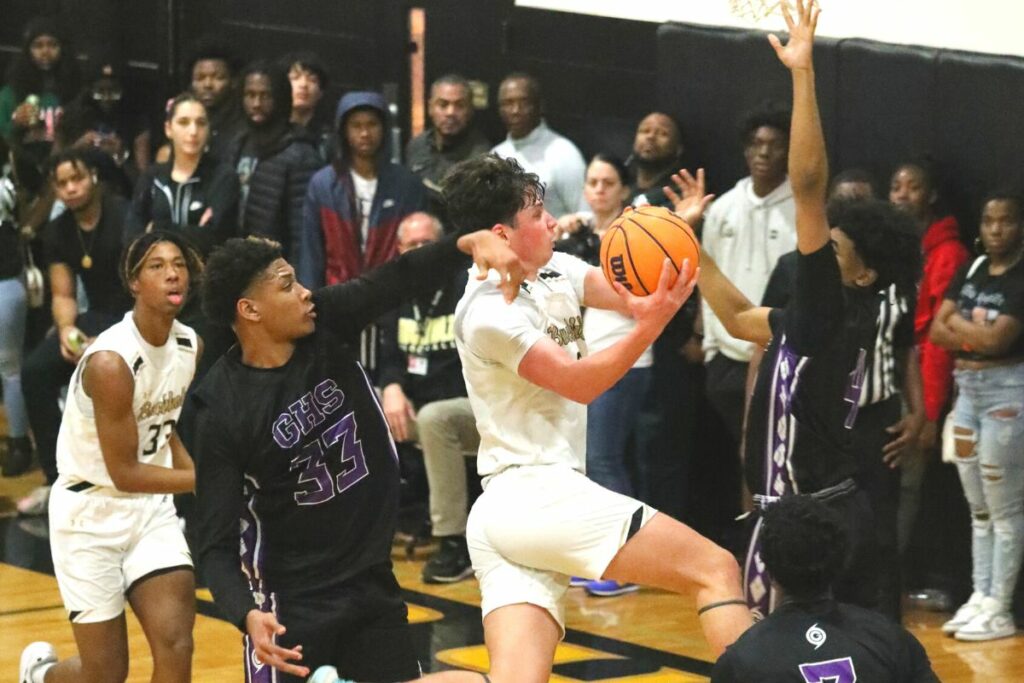 Buchholz's Jacob Sterck fouled on a drive to the basket against Gainesville on Friday.