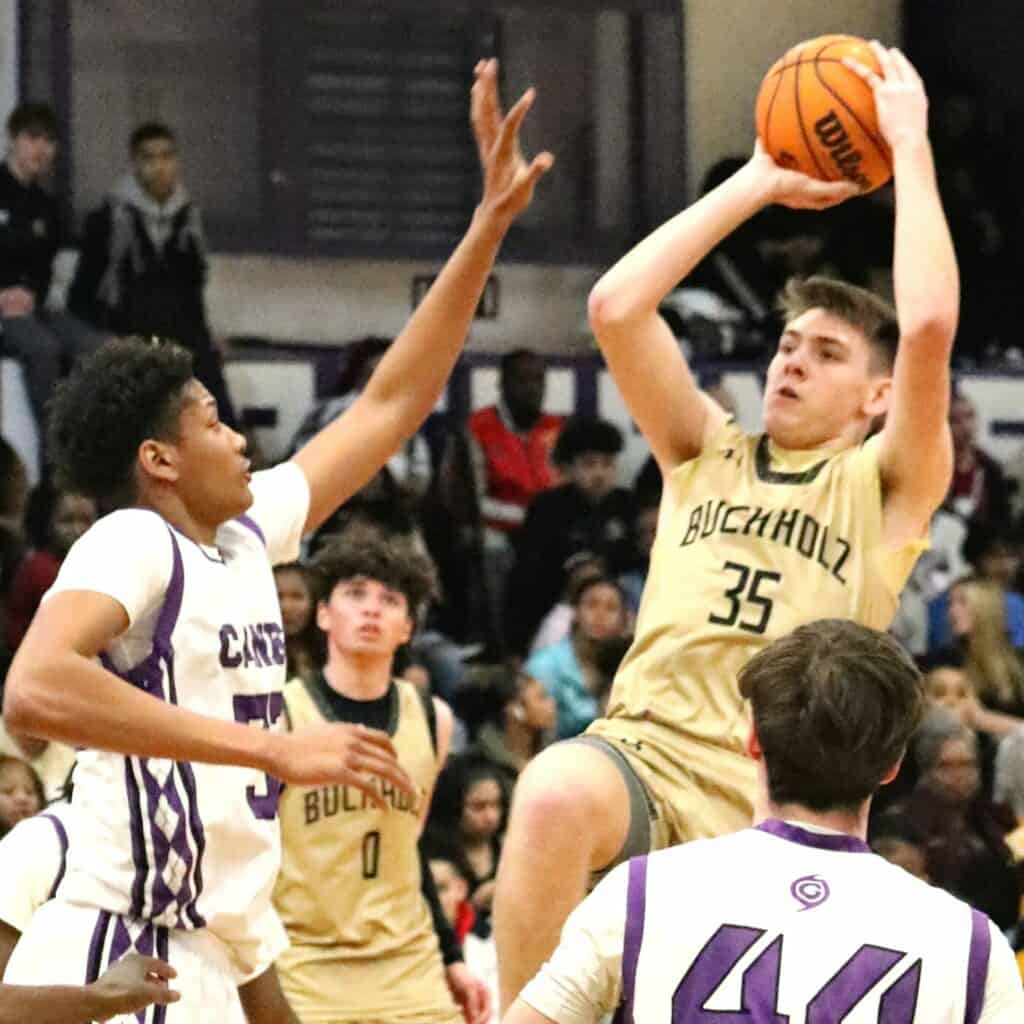 Buchholz's Palmer Walton (35) takes a shot againt Gainesville's Josh Hayes on Friday.