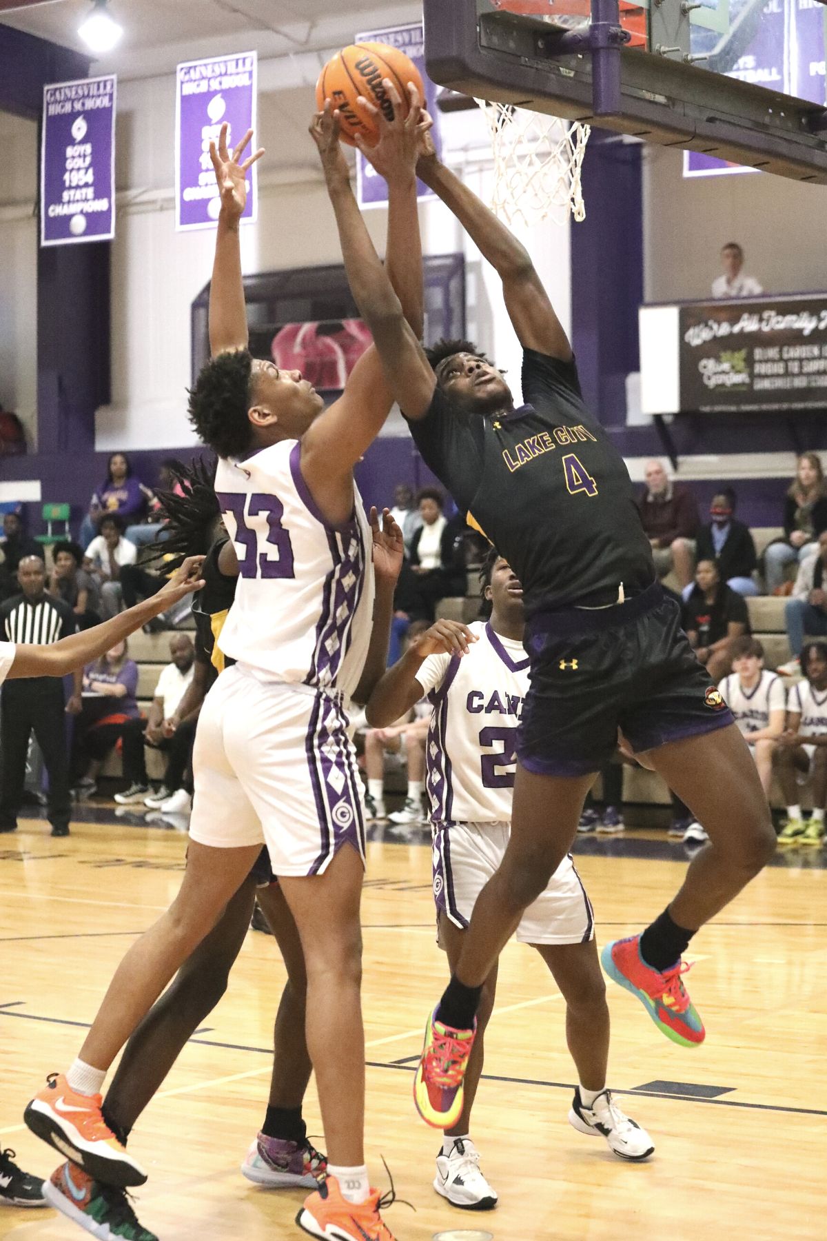 Columbia's Ty'jahn Wright and Gainesville's Josh Hayes battle for a rebound on Tuesday.