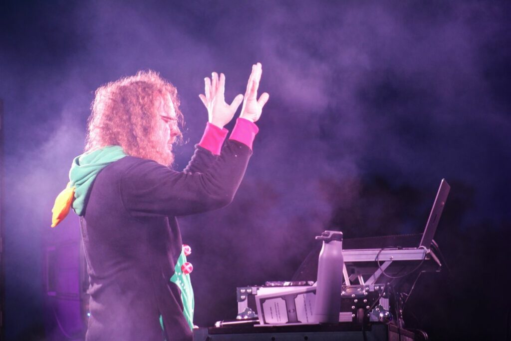 DJ Dad Jokes dances with the music at Sparks in the Park.