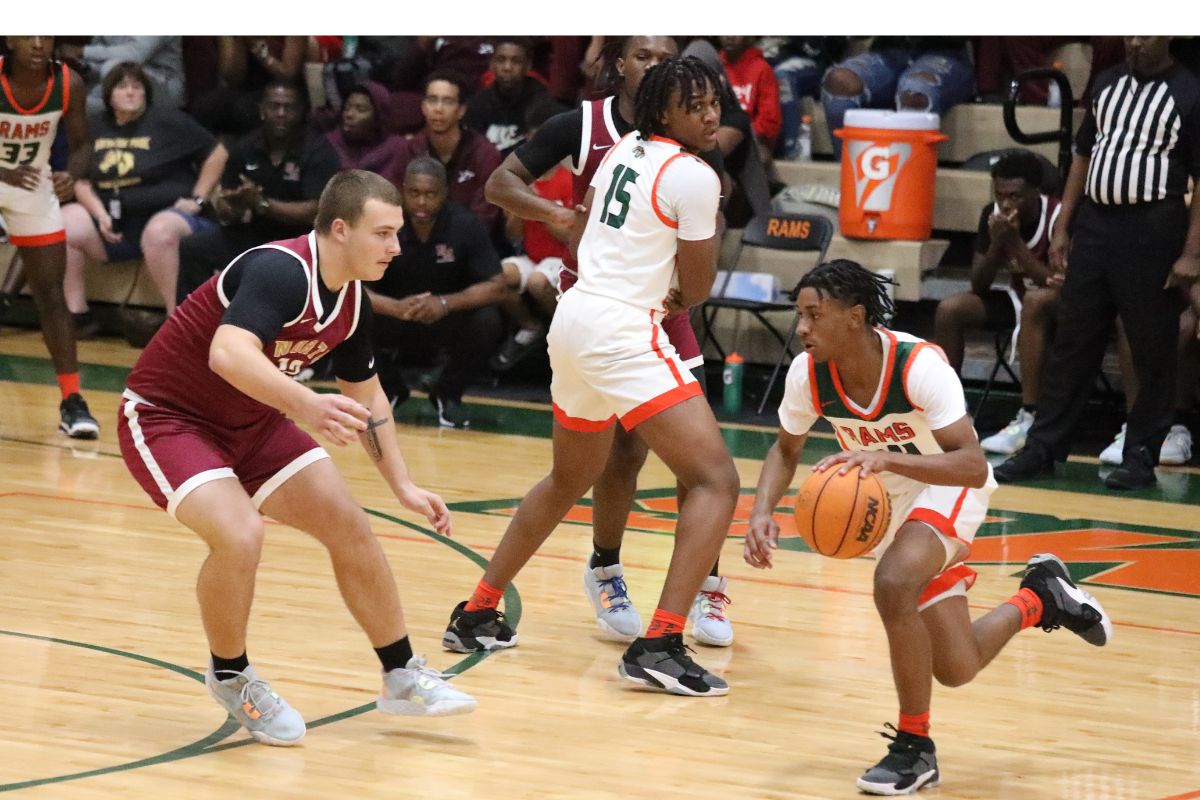 Eastside's Kelvin Baker dribbles down the court against North Marion on Friday.