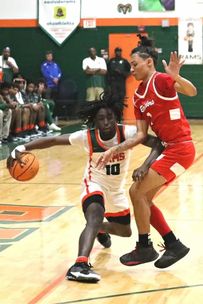 Eastside's Shelton Hall attempts to dribble around Santa Fe's Makhi Lewis on Tuesday.