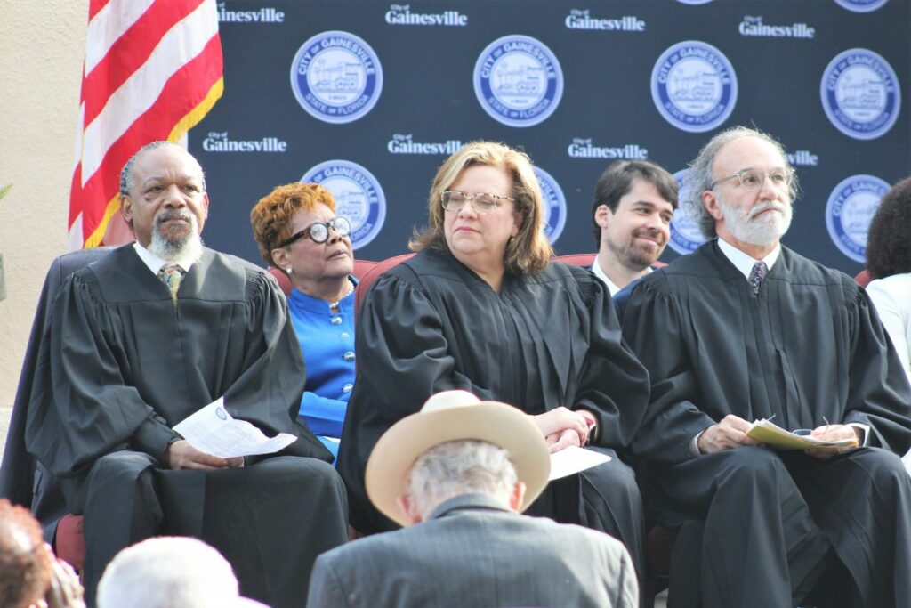 (From left) Judges Walter M. Green, Denise R. Ferrero and Craig C. DeThomasis at Thursday's Gainesville City Commission swearing-in ceremony.