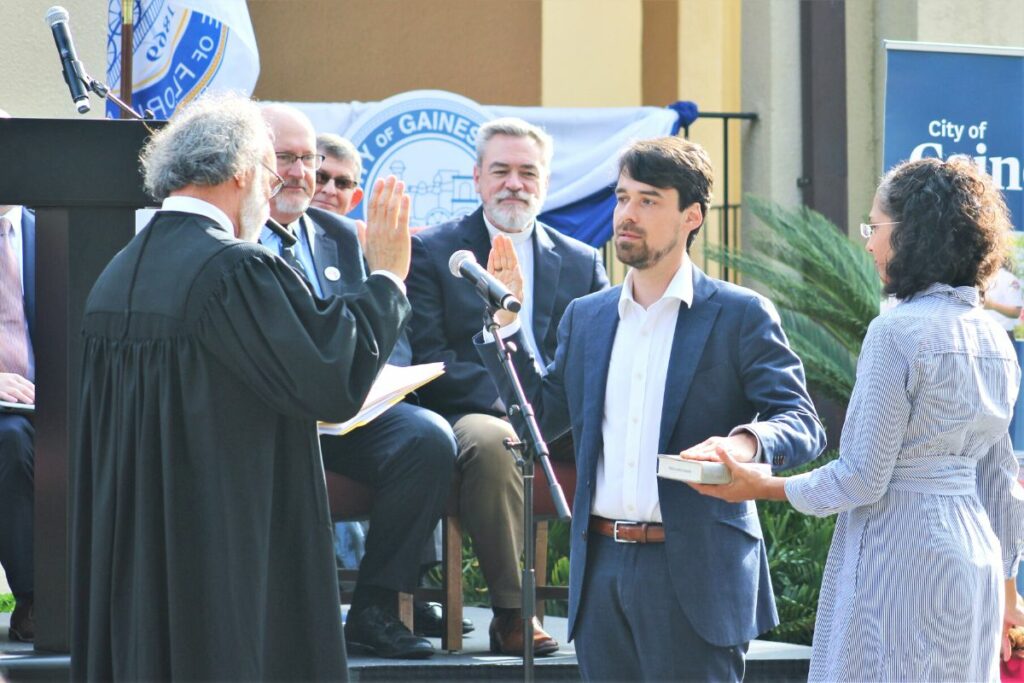 Gainesville City Commissioner Bryan Eastman takes his oath of office.