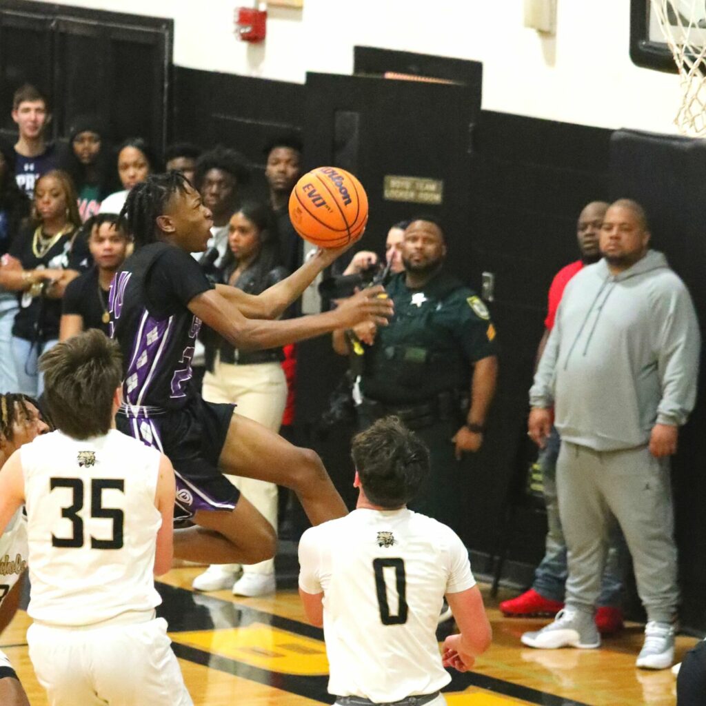 Gainesville's Dacarion Debose drives to the basket against Buchholz on Friday.